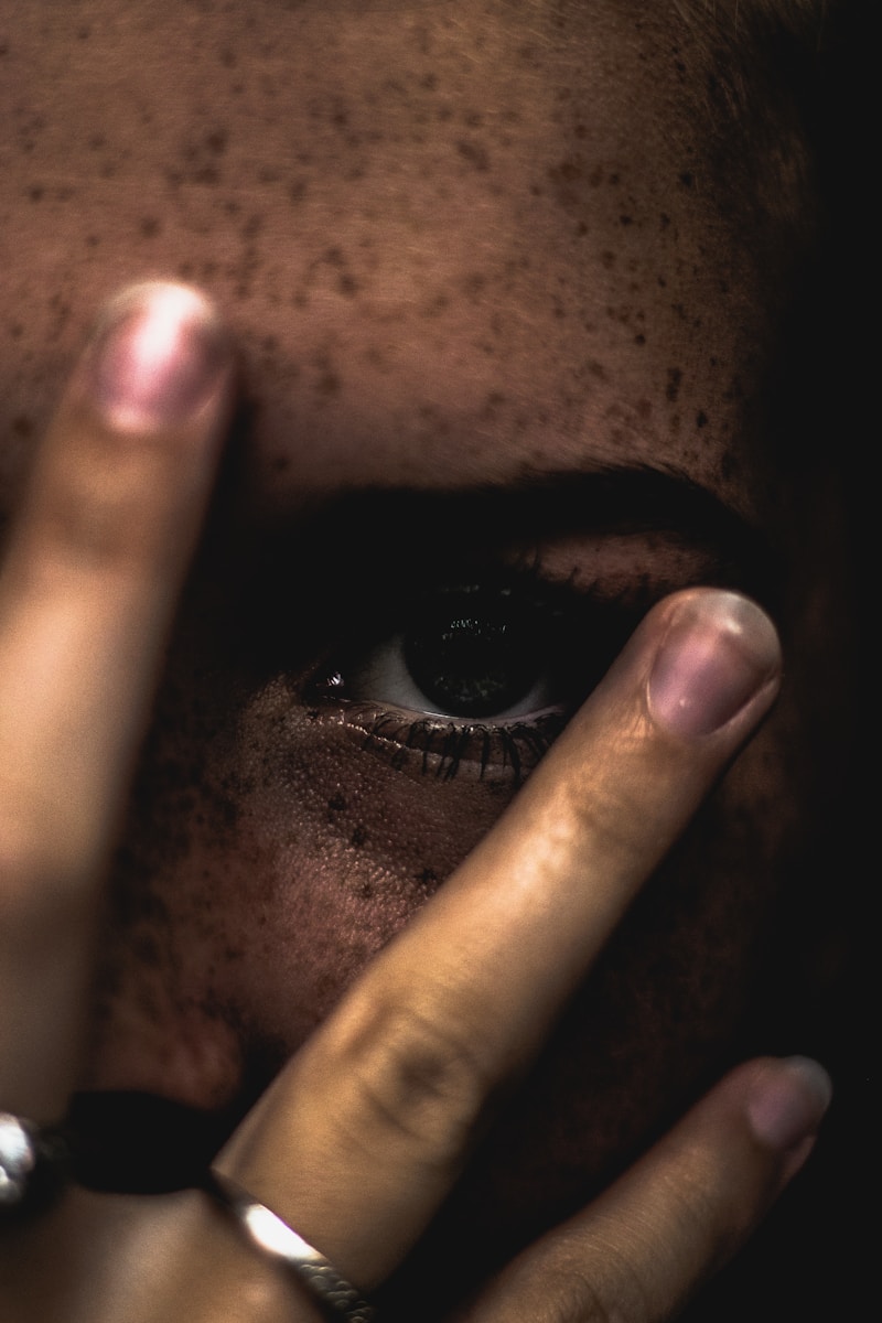 person covering face findom